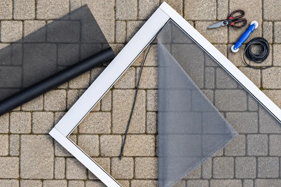 Custom window screen frame, mesh, spline and installation tools arranged together