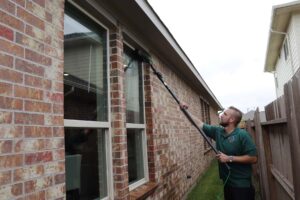 image with our window cleaning services being performed