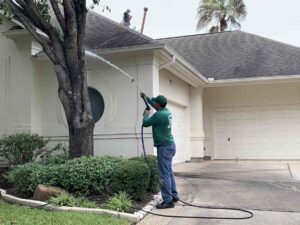 image with our firm performing pressure washing in houston